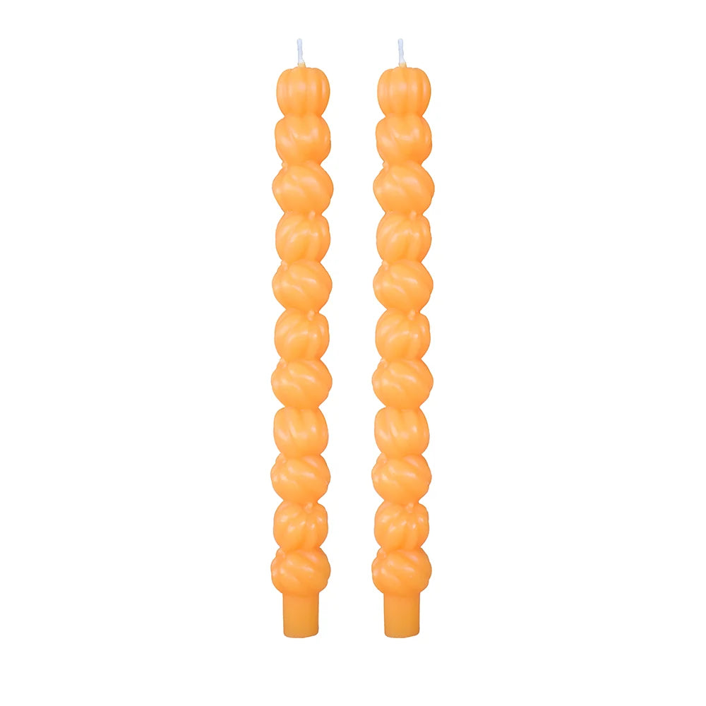 Stacked pumpkin taper candles in light orange